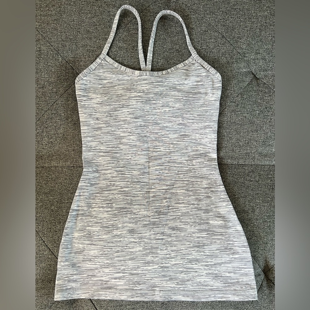 Lululemon workout top. White with gray printed design. Size 4